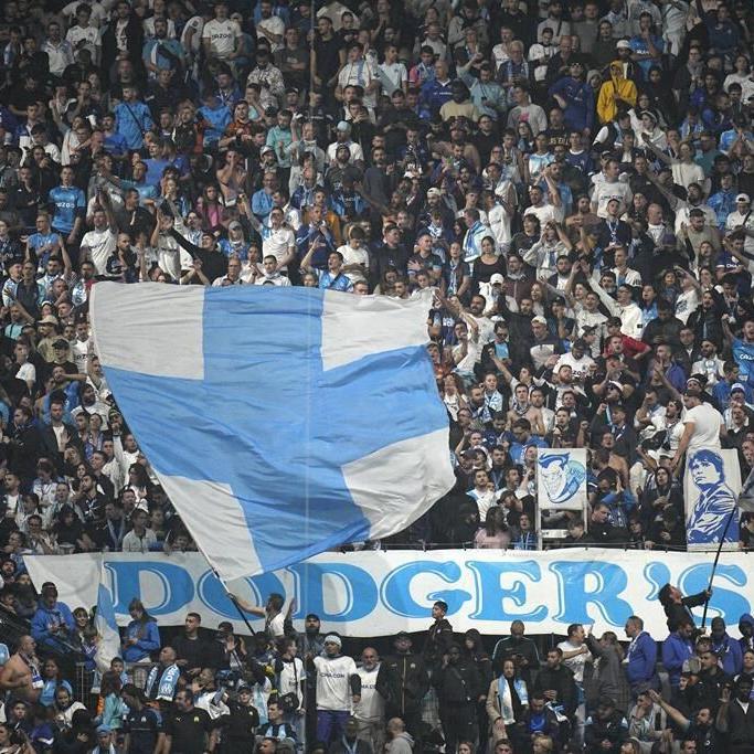 French government says 9 people detained after violent attack on Lyon soccer team buses